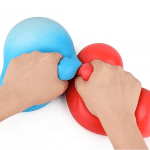 2 hands each squishing a giant squeezy stress ball