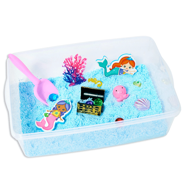 sensory bin with blue foam, mermaids, a treasure chest, gems, and a shovel