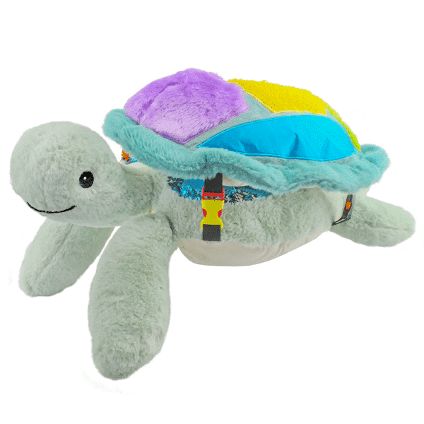 plush turtle with a clip on shell and lots of different textured fabric panels