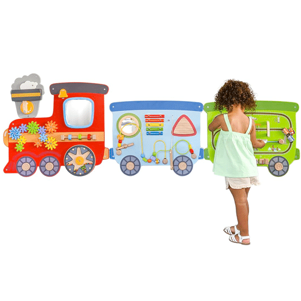 girl playing at a train activity wall panel